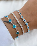 Conjunto de Pulseira Ponto de Luz Azul + Olho Grego + Elo Baiano - Prata - Áurea Acessórios
